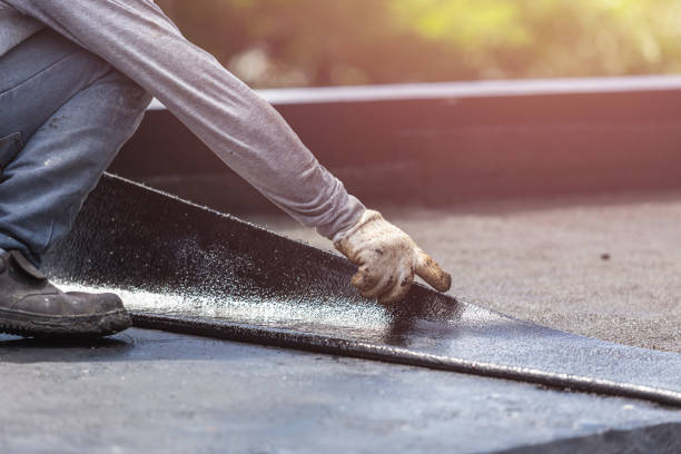 Professional Waterproofing technician working in Towson, MD
